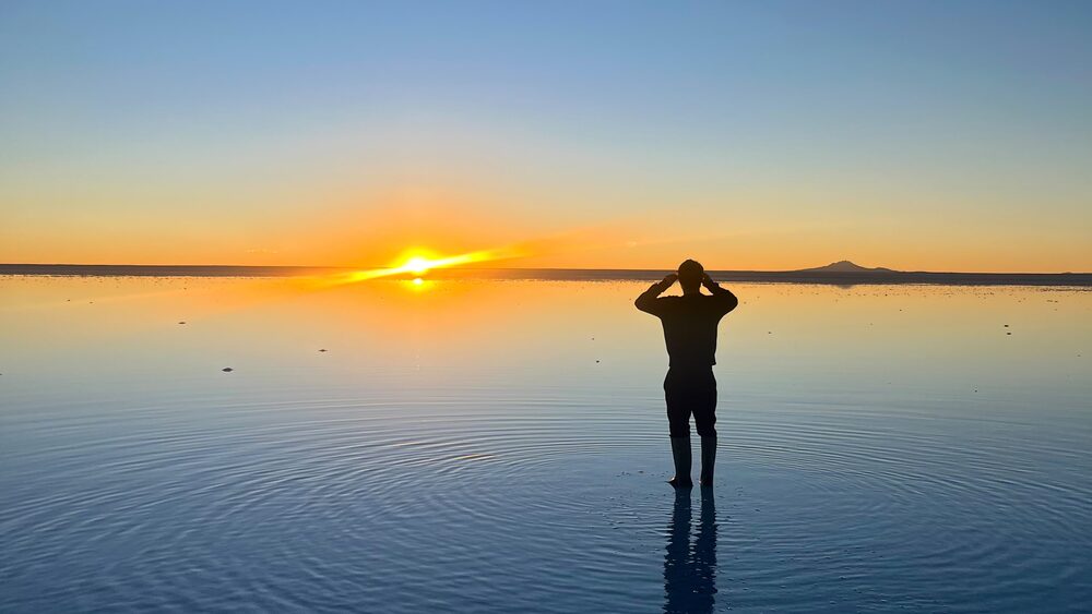 Sunrise over the flooded Uyuni salt flats, Bolivia
