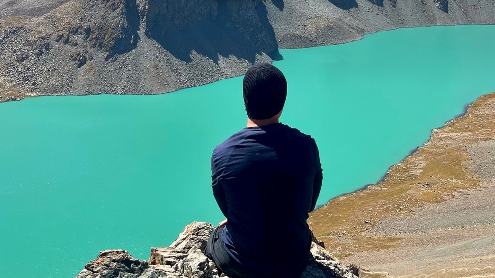 Looking down on the turquoise Ala-Kol lake in Kyrgyzstan